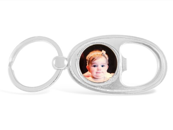 a keychain with a photo of a baby inside it