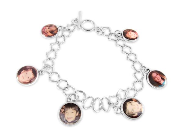 a silver bracelet with four pictures of people on it
