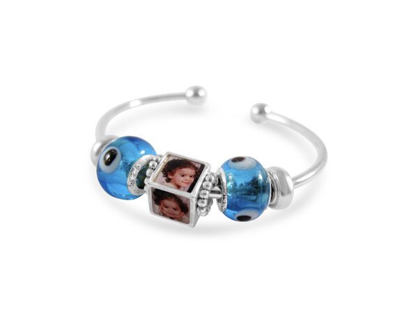 a blue bracelet with two pictures on it
