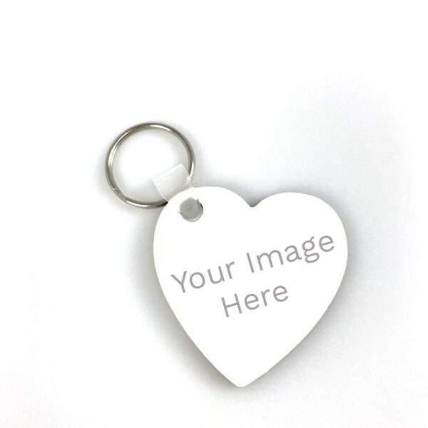 a white heart shaped keychain with the words your image here on it