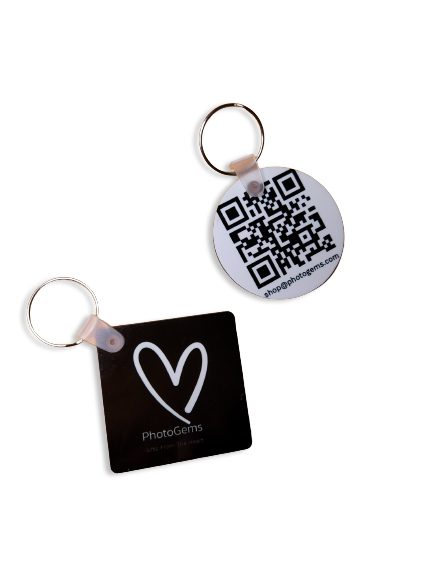 two key chains with a qr code on them